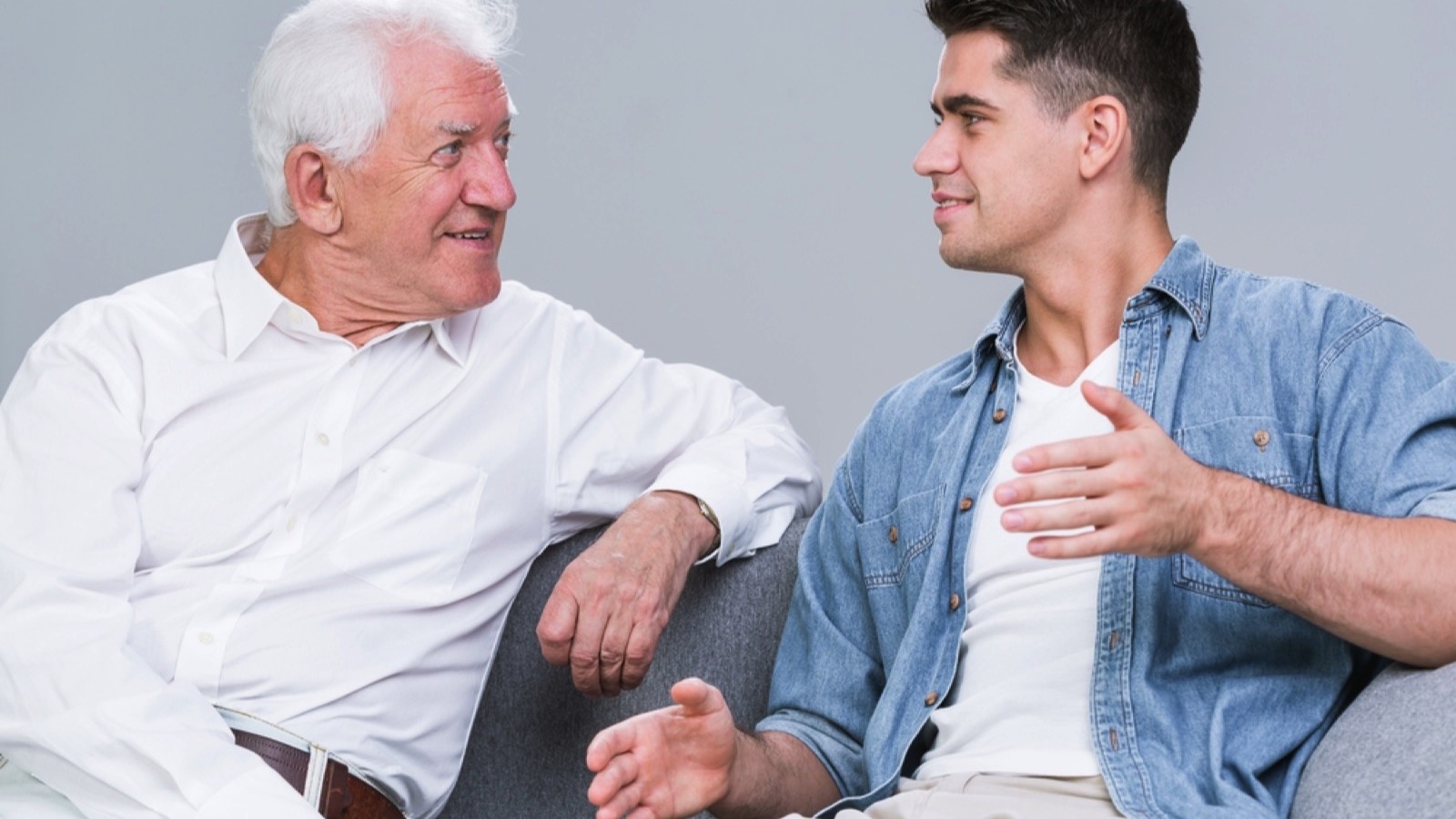 Man discussing with old man