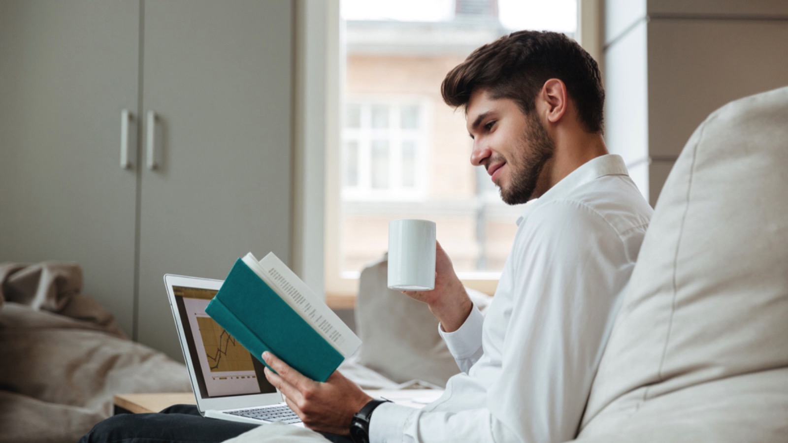 Man having coffee and reading