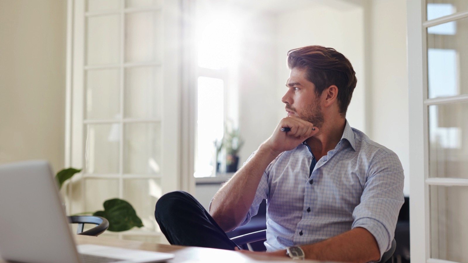 Man thinking siting at home